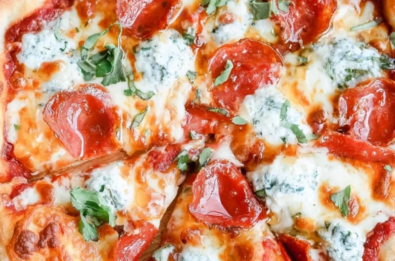 Delicious Hot Honey Pizza topped with spicy honey drizzles and fresh ingredients.