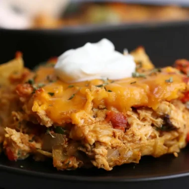 King Ranch Chicken Casserole served in a baking dish with toppings.