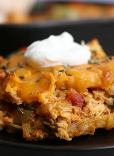 King Ranch Chicken Casserole served in a baking dish with toppings.