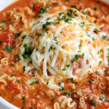 Bowl of delicious Lasagna Soup topped with cheese and herbs