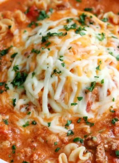 Bowl of delicious Lasagna Soup topped with cheese and herbs