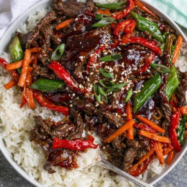 Delicious plate of Mongolian Beef with vegetables and rice