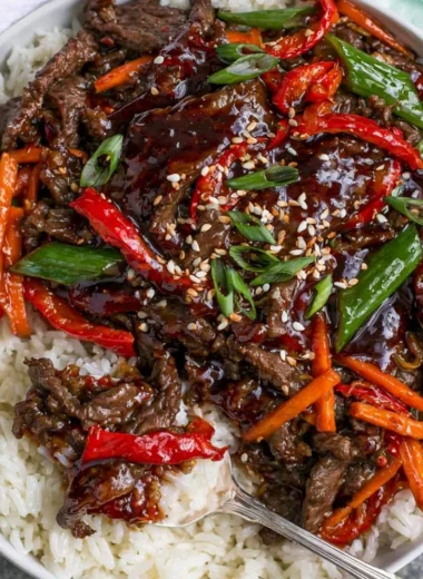 Delicious plate of Mongolian Beef with vegetables and rice