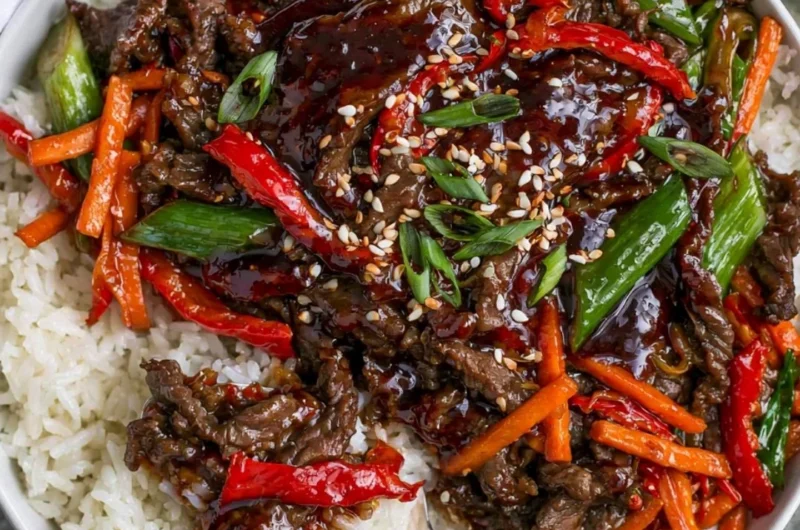 Delicious plate of Mongolian Beef with vegetables and rice