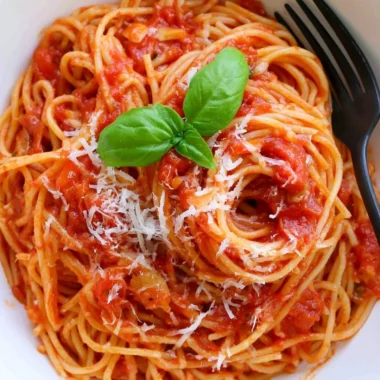 Delicious homemade Pasta Tomato with fresh ingredients and herbs