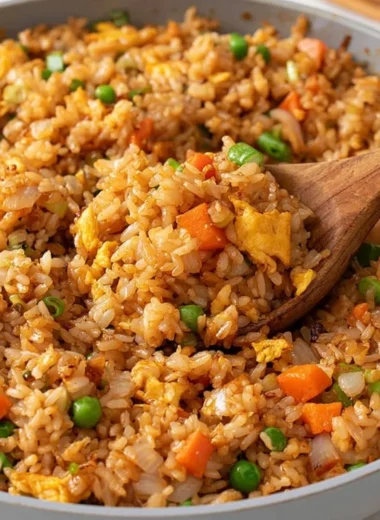 A plate of quick and easy homemade fried rice with colorful vegetables