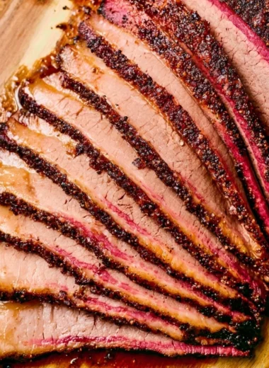 Delicious smoked pellet grill brisket displayed on a wooden board