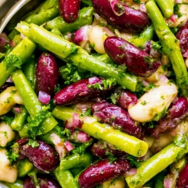 Three Bean Salad with mixed beans and fresh vegetables in a bowl