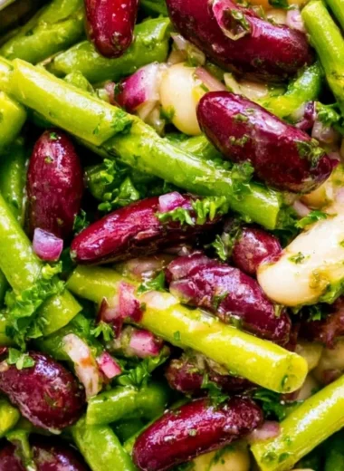Three Bean Salad with mixed beans and fresh vegetables in a bowl