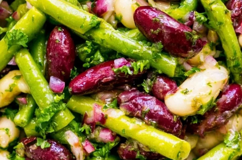 Three Bean Salad with mixed beans and fresh vegetables in a bowl