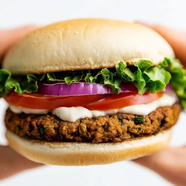 Delicious Vegan Falafel Burger served with fresh vegetables and toppings