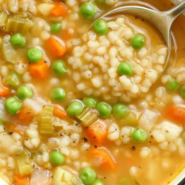 Bowl of Veggie Barley Soup with fresh vegetables and barley grains.