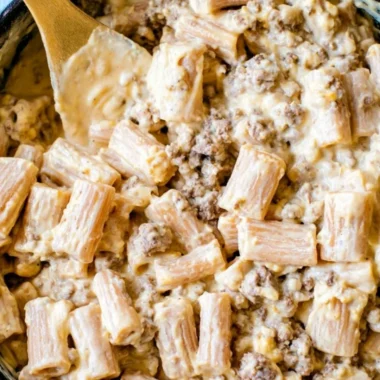 Delicious cheeseburger pasta skillet topped with cheese and garnished with parsley