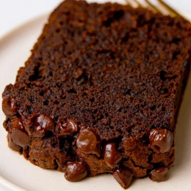 Sliced double chocolate pumpkin bread showcasing rich chocolate and pumpkin flavors