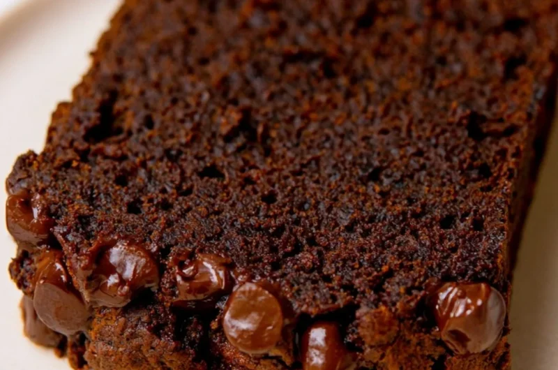 Sliced double chocolate pumpkin bread showcasing rich chocolate and pumpkin flavors