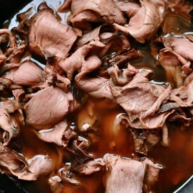 Easy French Dip Sandwich with roast beef and provolone cheese