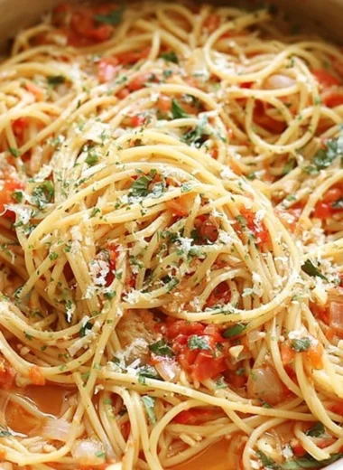 A bowl of flavorful One Pot Pasta with vegetables and herbs