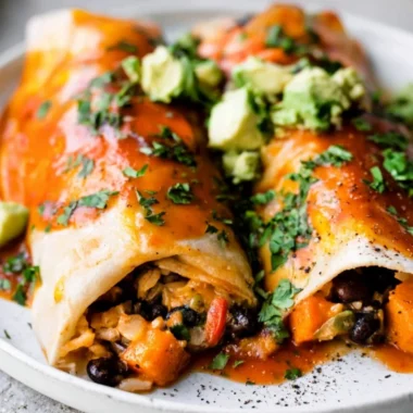 Delicious vegetarian enchiladas topped with fresh ingredients and cheese