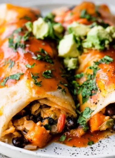 Delicious vegetarian enchiladas topped with fresh ingredients and cheese