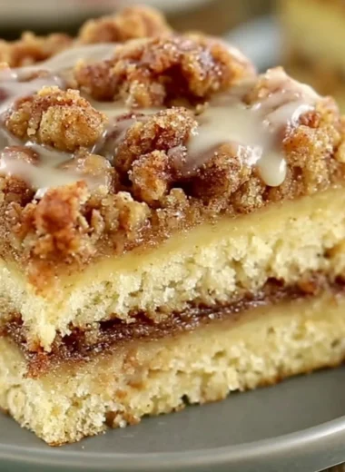 Delicious coffee cake with crumb topping and a slice cut