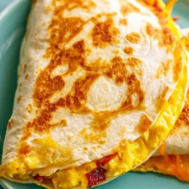 Delicious breakfast quesadilla filled with eggs, cheese, and veggies