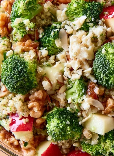Broccoli Apple Quinoa Salad with fresh vegetables and apples in a bowl