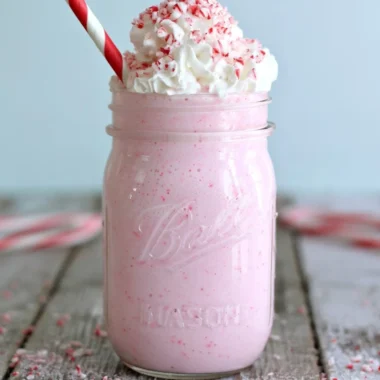 Delicious Candy Cane Milkshake topped with whipped cream and crushed candy canes