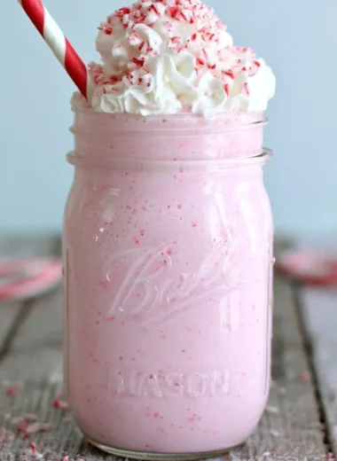 Delicious Candy Cane Milkshake topped with whipped cream and crushed candy canes