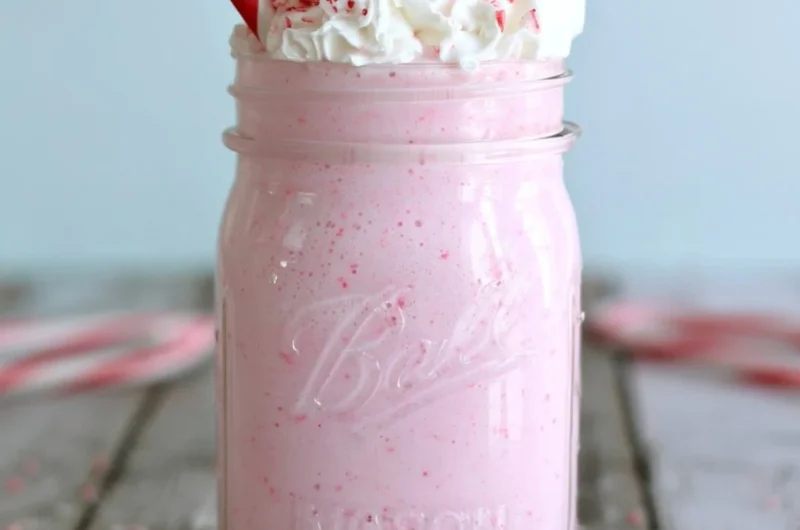Delicious Candy Cane Milkshake topped with whipped cream and crushed candy canes