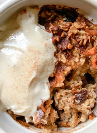Delicious carrot cake baked oatmeal topped with cream cheese frosting