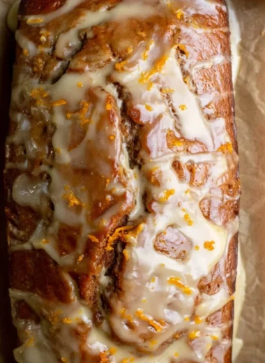 Loaf of easy gingerbread bread topped with spices and decorative icing