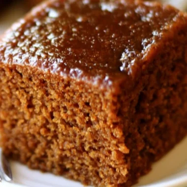 Delicious slice of easy gingerbread cake with frosting and decoration