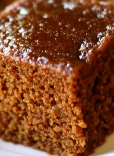 Delicious slice of easy gingerbread cake with frosting and decoration