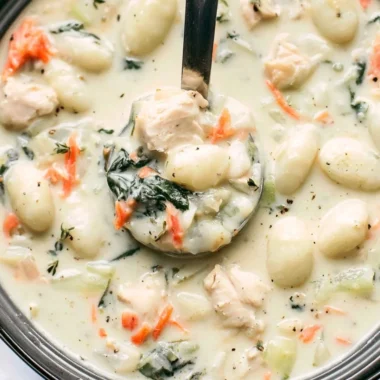 Bowl of Olive Garden Chicken Gnocchi Soup with chicken, gnocchi, and vegetables