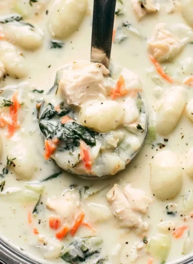 Bowl of Olive Garden Chicken Gnocchi Soup with chicken, gnocchi, and vegetables